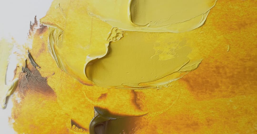 Swatches of paint mixed with varying amounts of white. The masstone is a brown while the tints are golden yellow.