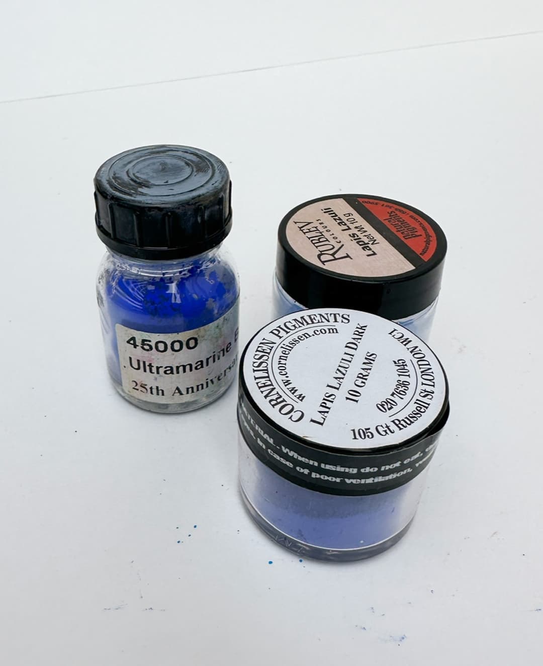 Three jars of pigment--ultramarine blue synthetic as well as two jars of genuine Lapis Lazuil pigment