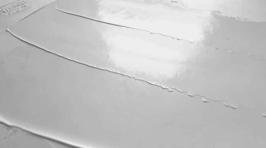 Vasari Titanium White in Linseed Oil spread thinly with a palette knife. Their version is glossy, smooth and gliding